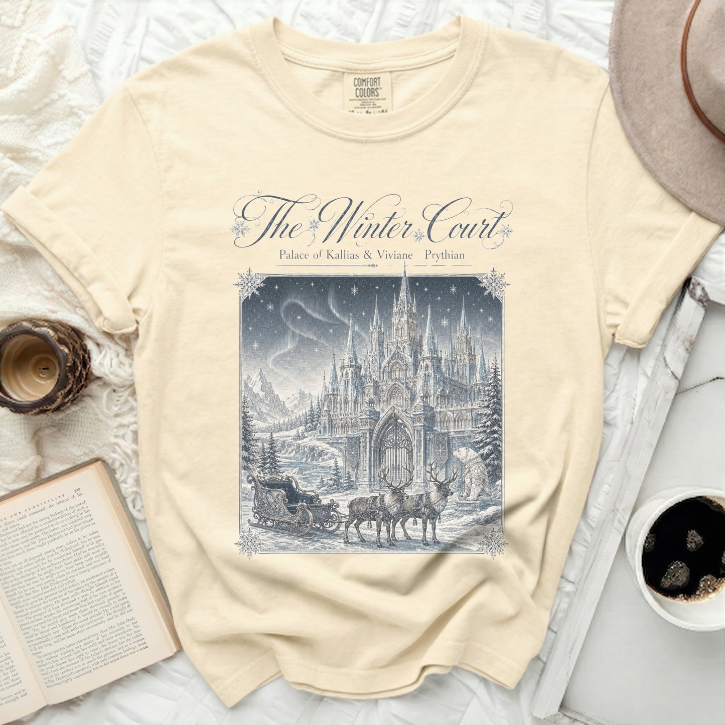 The Winter Court graphic tee with a castle, sleigh, reindeer, and polar bear scene.