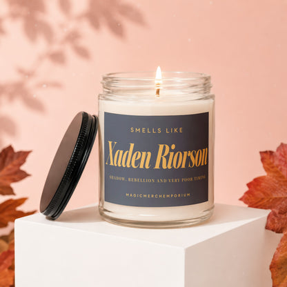 Scented candle labeled "Xaden Riorson" with text "Shadow, Rebellion and Very Poor Timing".