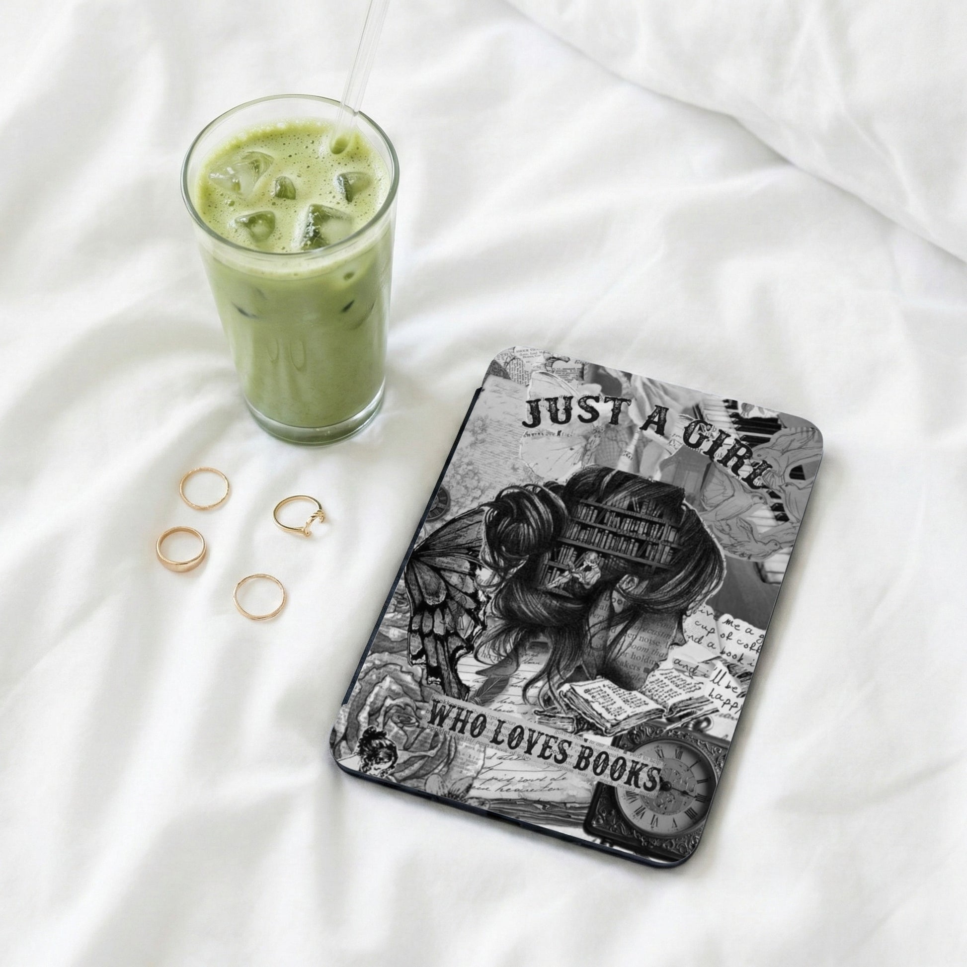 Phone case with "Just a girl who loves books" text, fairy wings, books, and clock.