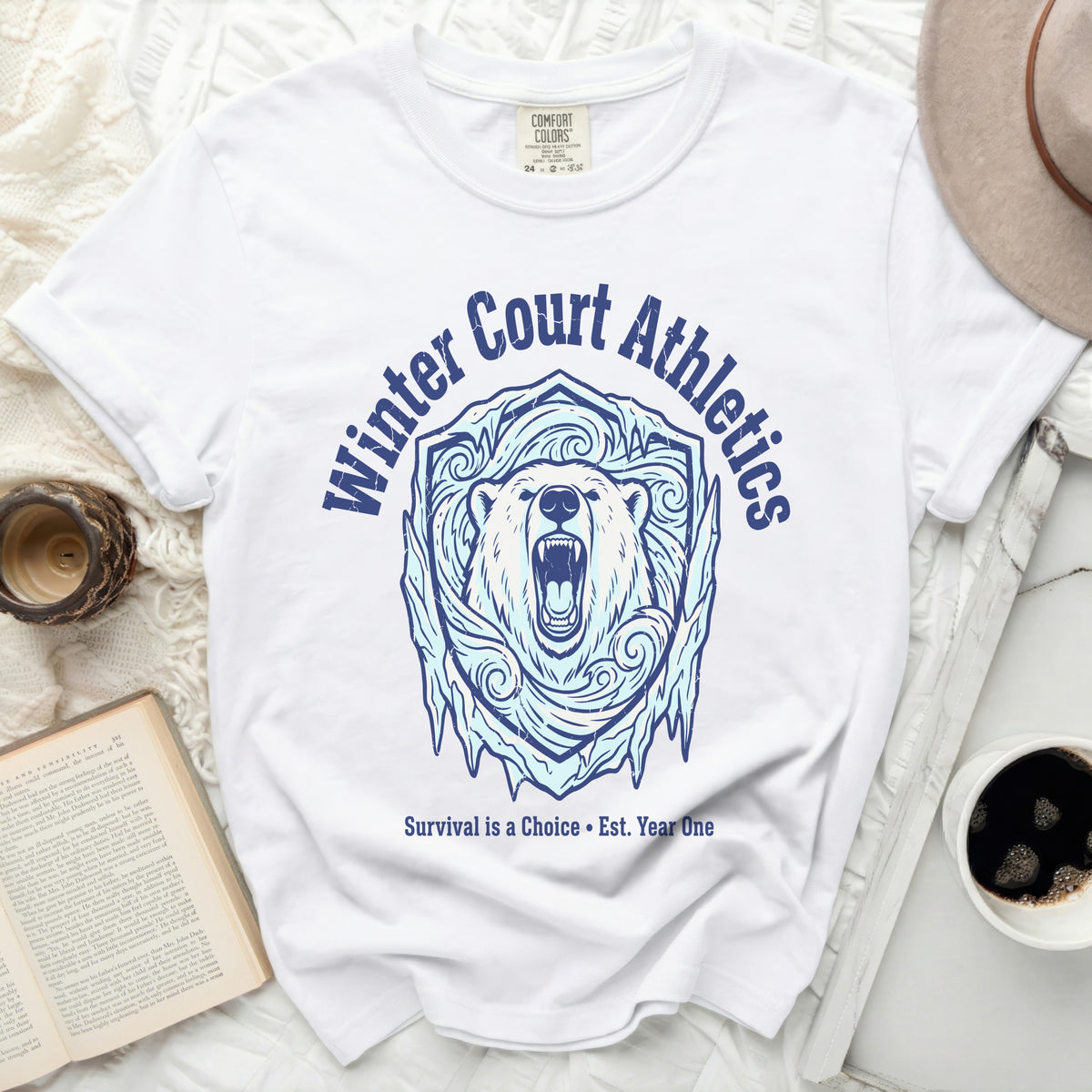White t-shirt with polar bear and ice shield graphic.