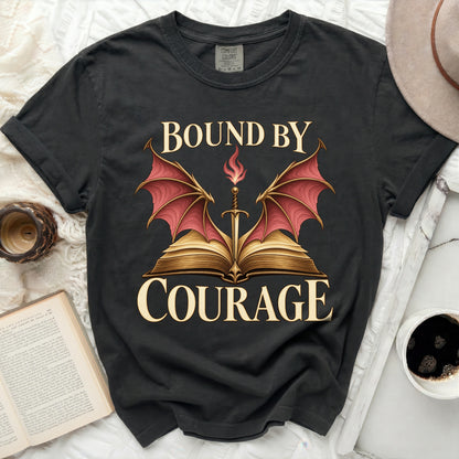 Black t-shirt with "BOUND BY COURAGE" text and a sword above an open book.