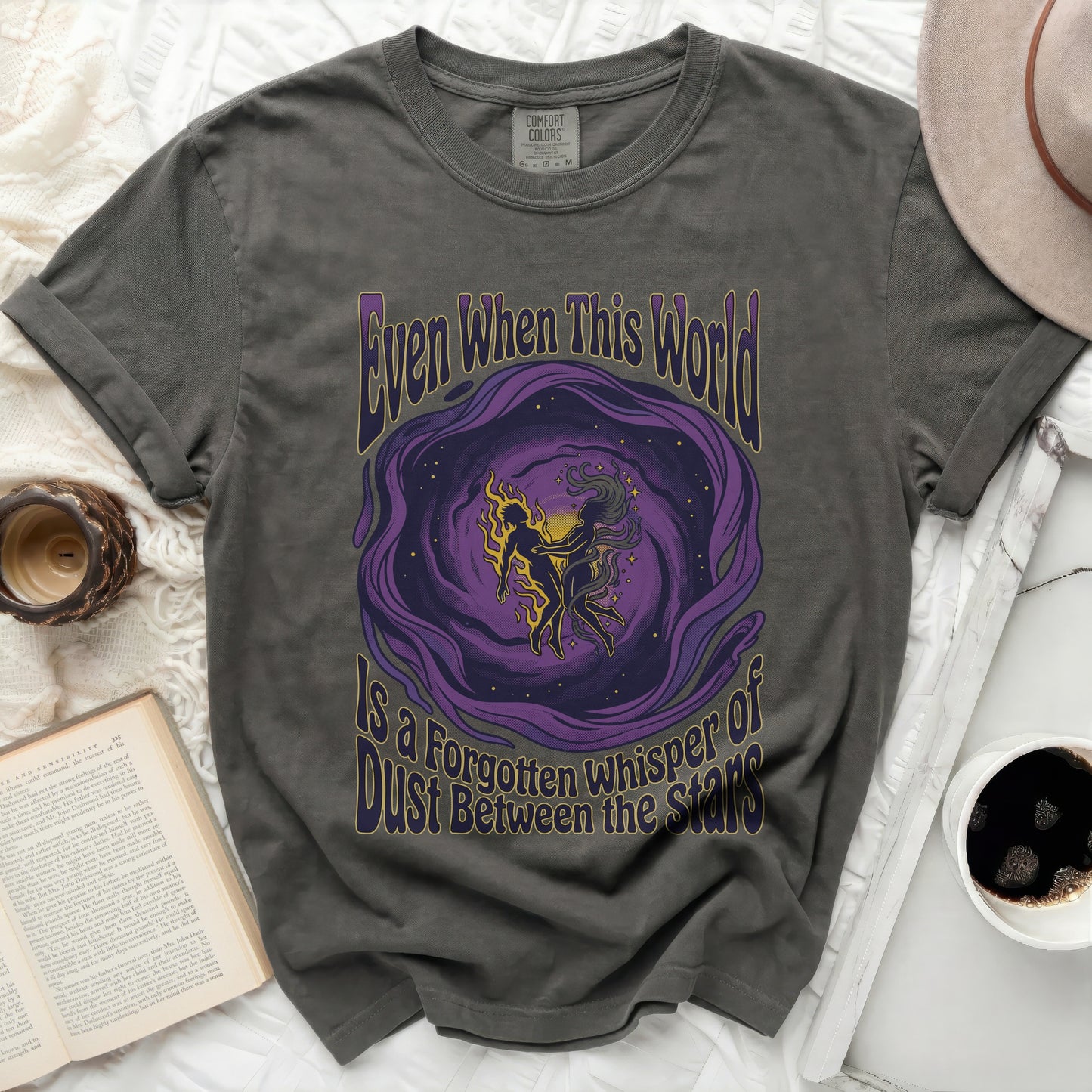 Dark grey t-shirt with "Even When This World Is A Forgotten Whisper Of Dust Between The Stars" text.