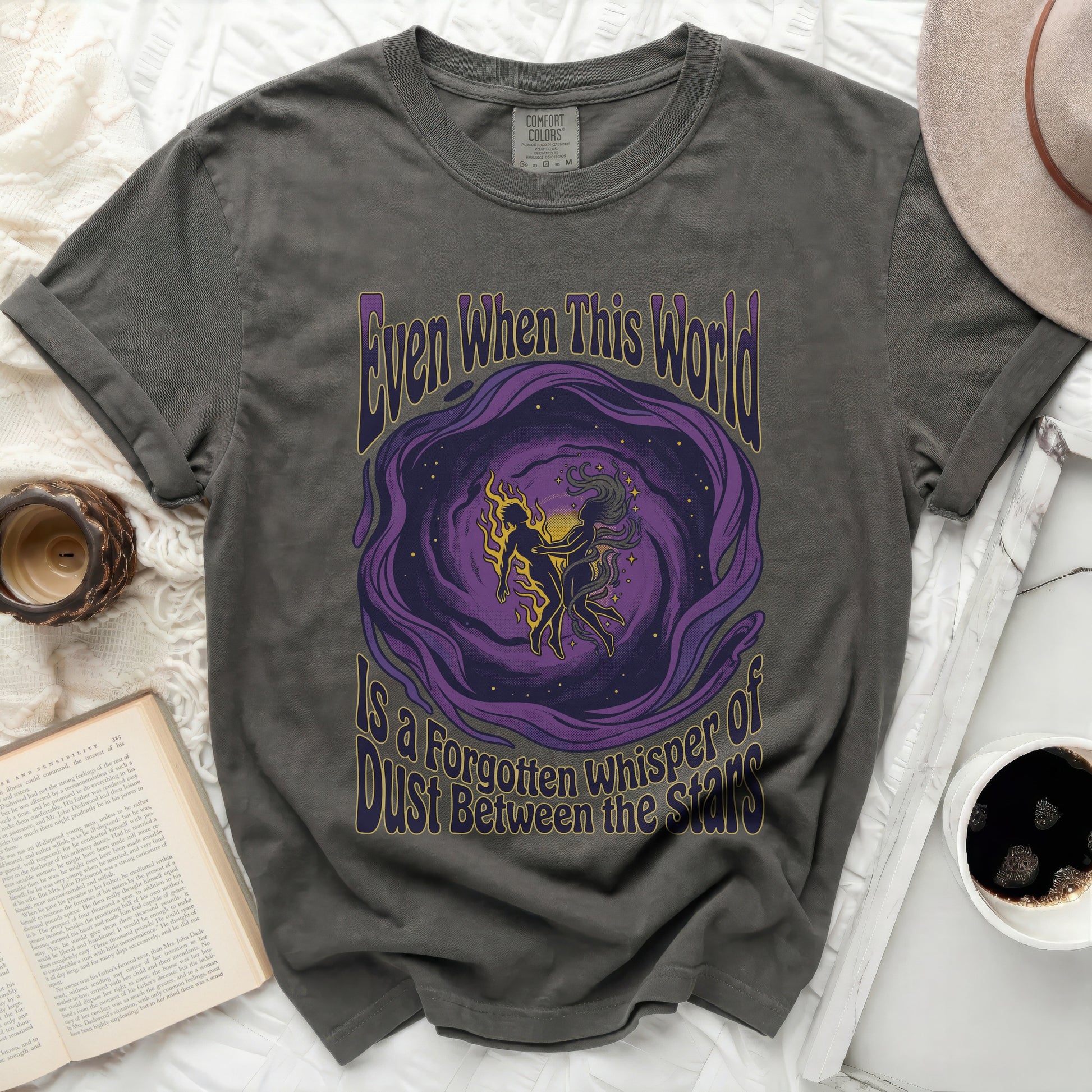 Dark grey t-shirt with "Even When This World Is A Forgotten Whisper Of Dust Between The Stars" text.