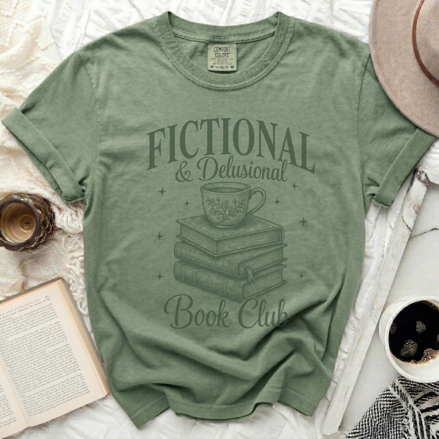 Green t-shirt with "Fictional & Delusional Book Club" graphic.