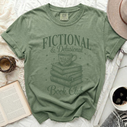 Green t-shirt with "Fictional & Delusional Book Club" graphic.