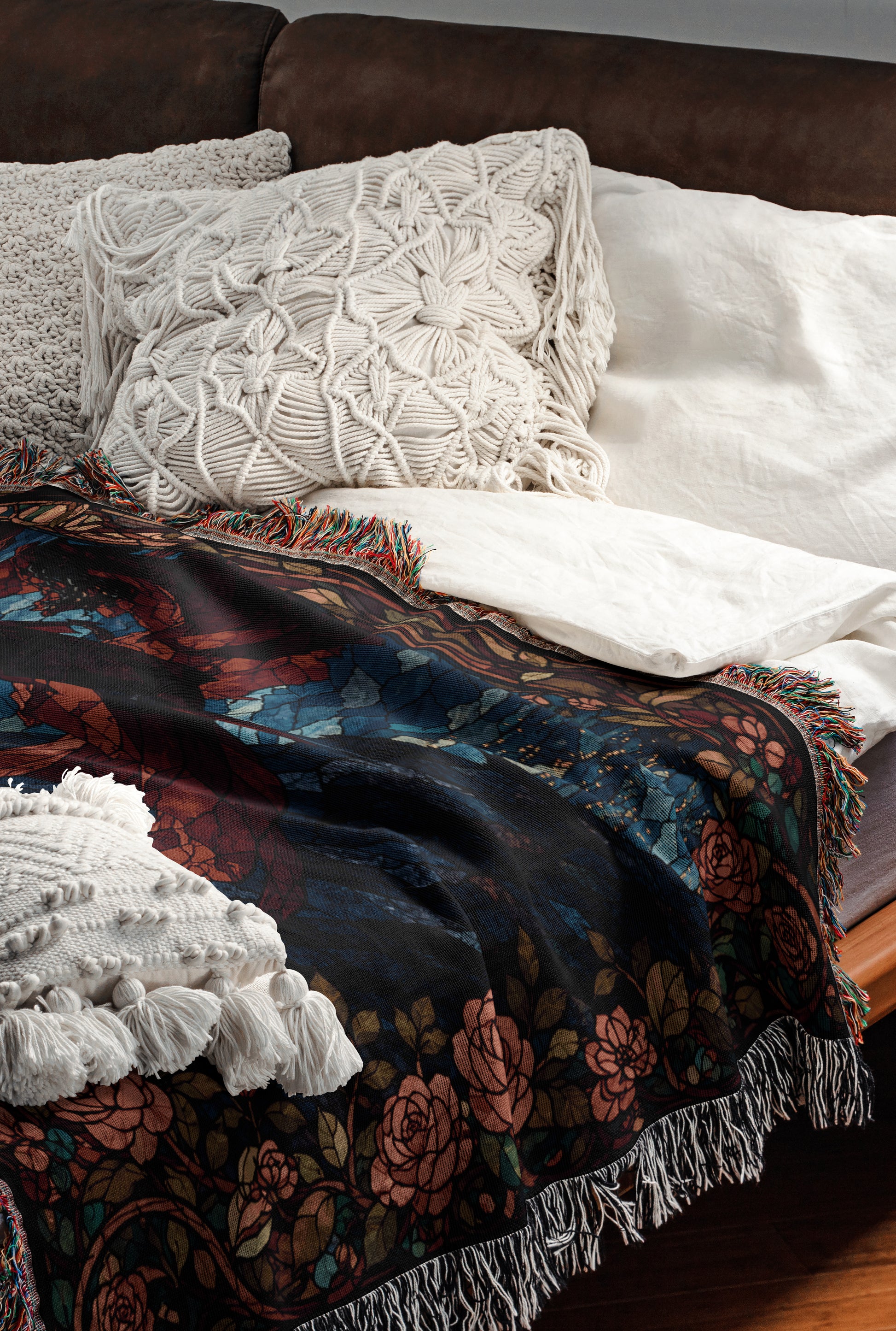 a cozy and inviting bedroom scene, featuring a bed with a colorful floral patterned blanket and a white pillow.