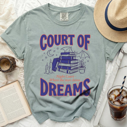 Green t-shirt with "COURT OF DREAMS" and starry night graphic.