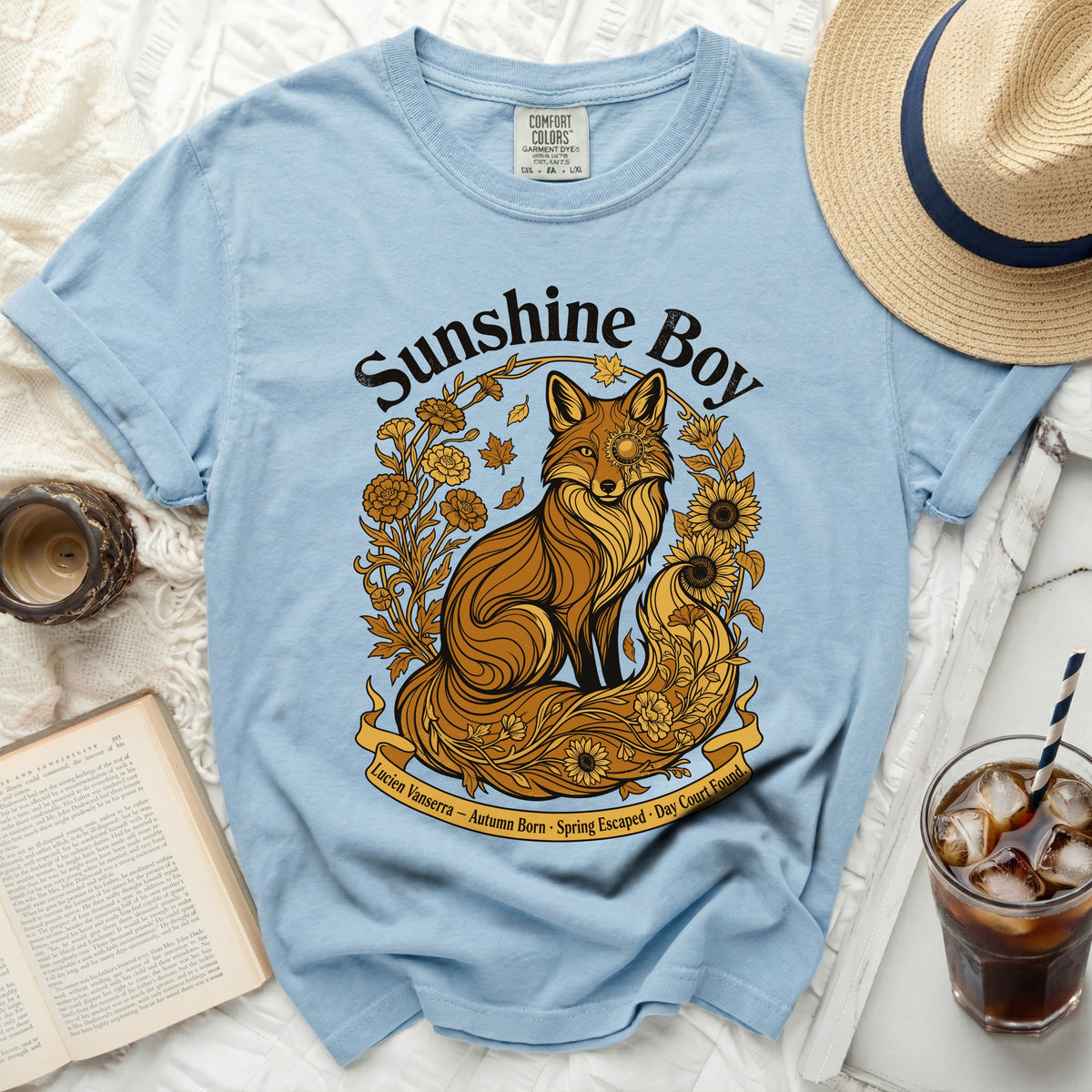 Light blue t-shirt with a gold illustrated fox and floral design.