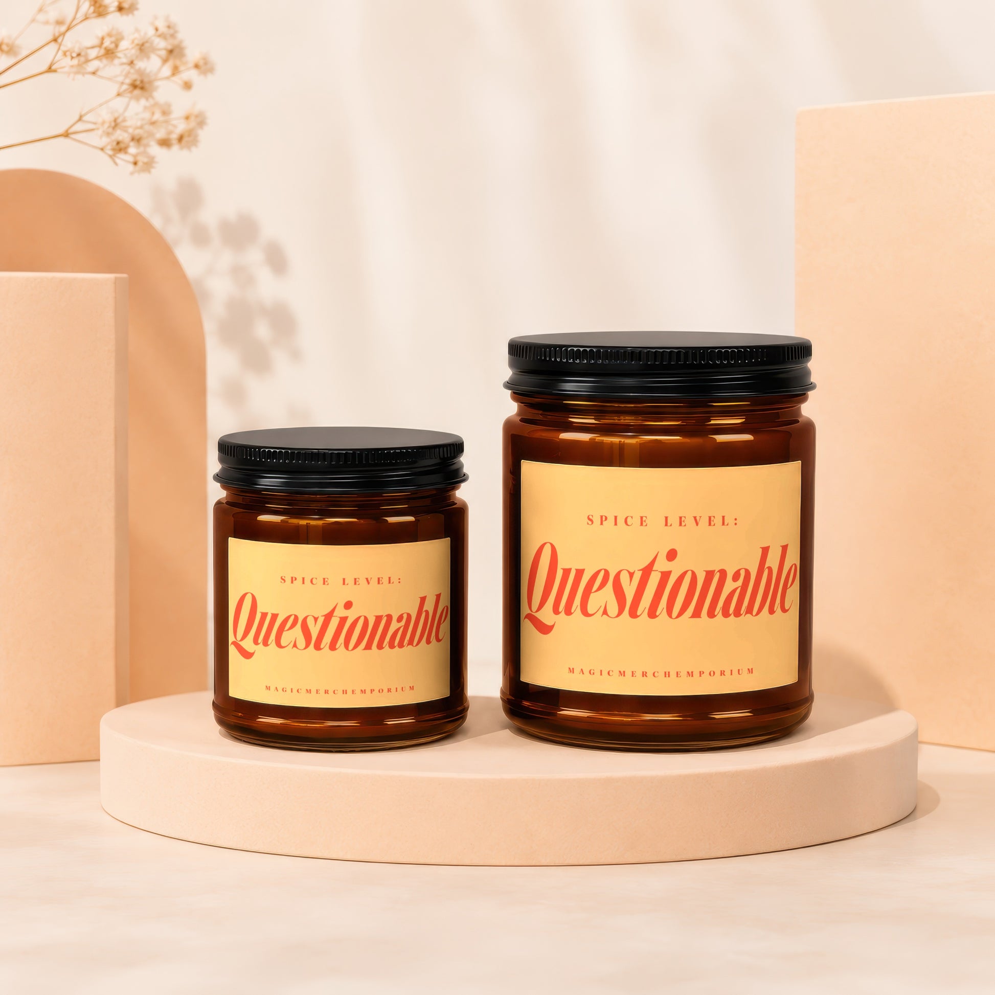 Two amber glass jars with black lids, one larger, each labeled "Questionable" spice level.