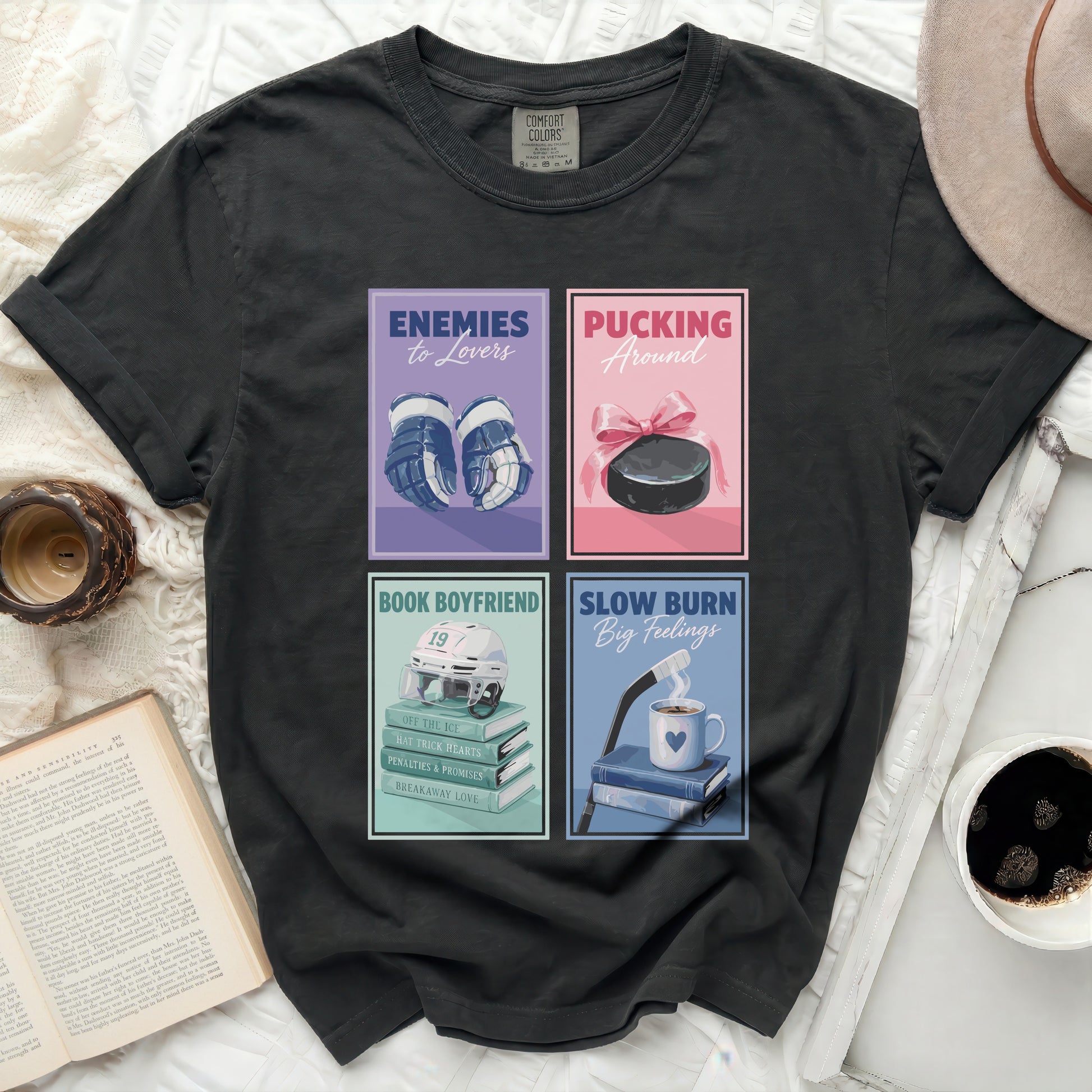T-shirt with four graphic novel style book covers: hockey, puck, and romance themes.