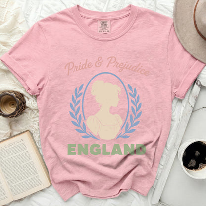 Pink t-shirt with "Pride & Prejudice" and a silhouette of a woman.