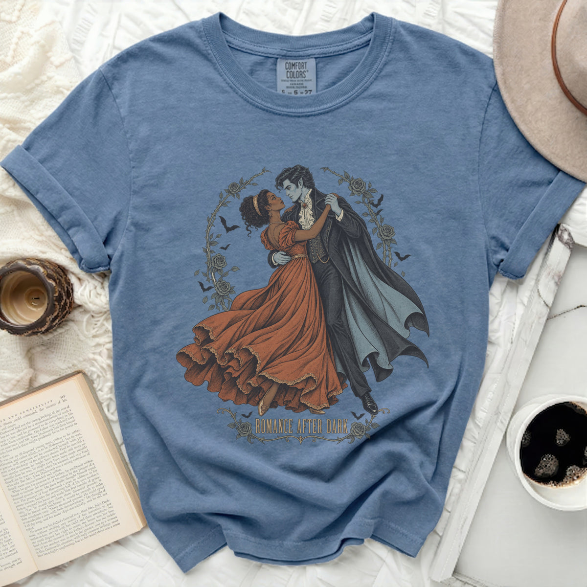 Blue t-shirt with "Romance After Dark" graphic of a vampire couple dancing.