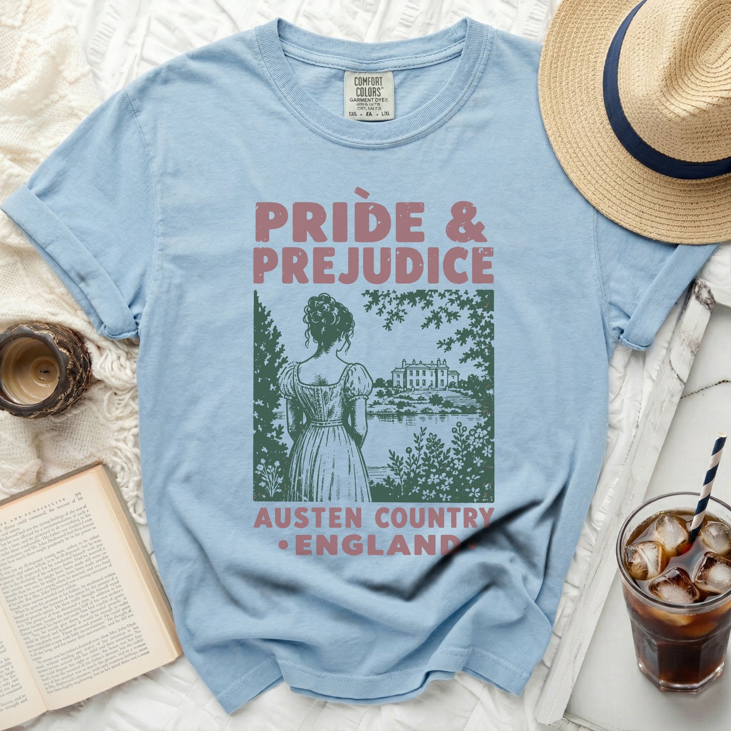 Light blue t-shirt with "Pride & Prejudice Austen Country England" graphic.