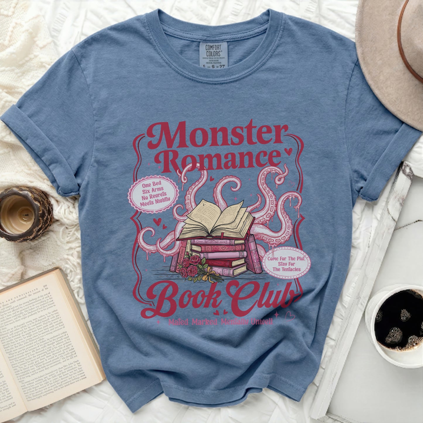 Blue t-shirt with "Monster Romance Book Club" graphic and tentacles.