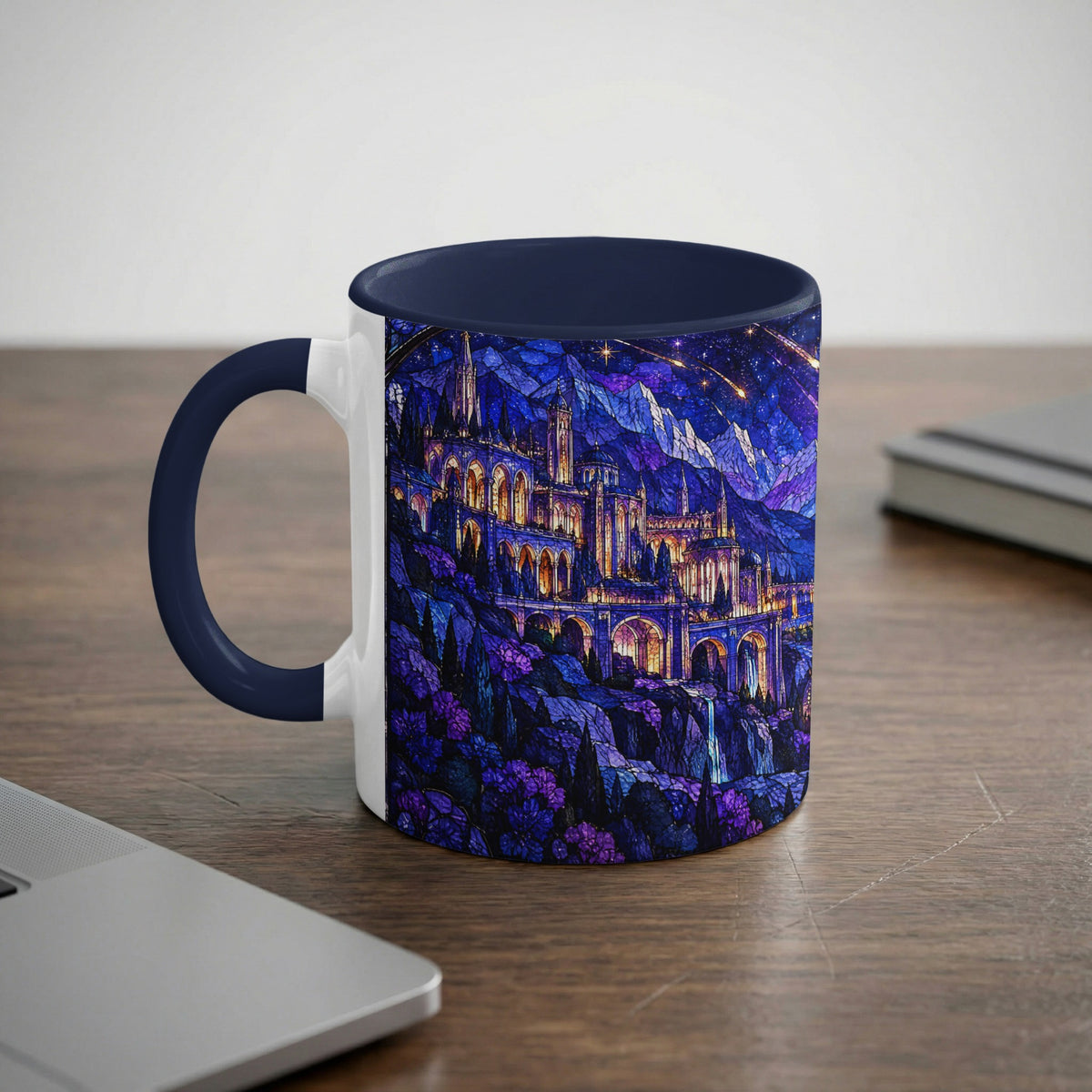 A white ceramic mug with a dark blue handle and rim featuring a fantasy castle print.
