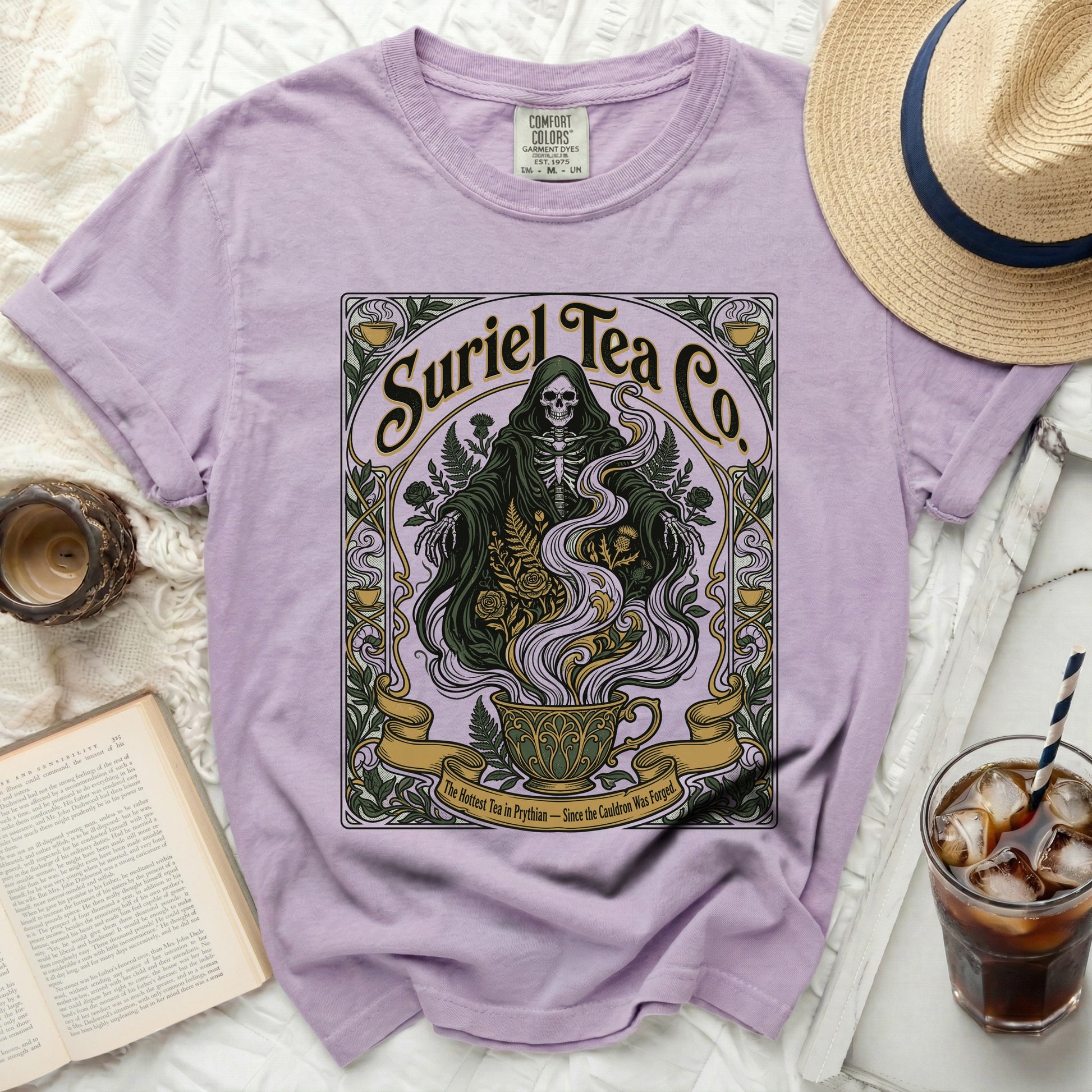 Purple t-shirt with Grim Reaper and teacup graphic, "Suriel Tea Co." text.