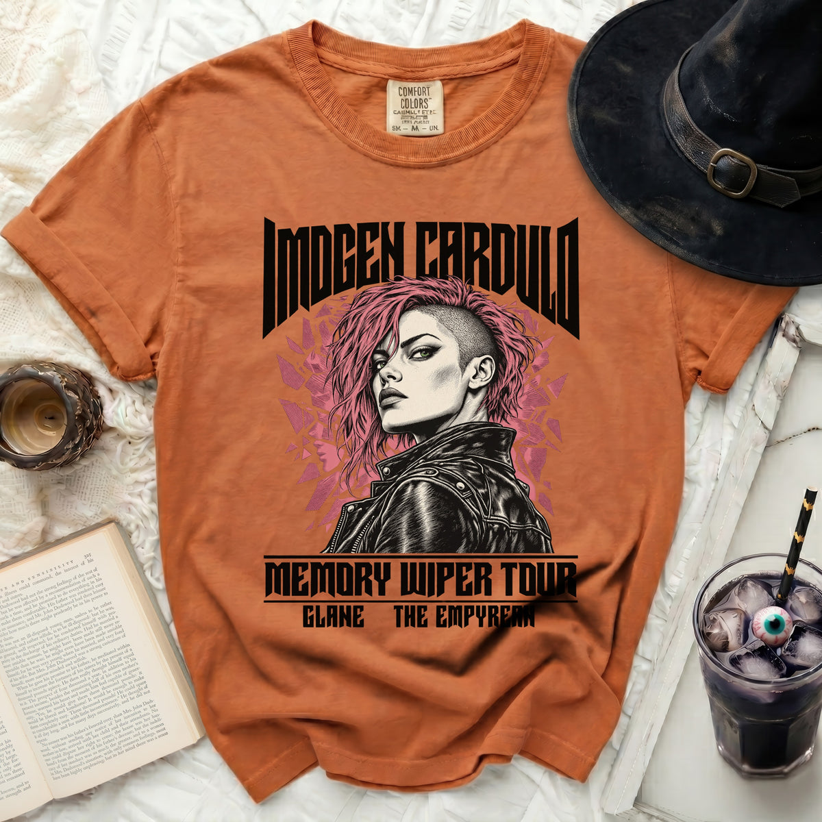 Orange t-shirt with Imogen Cardullo "Memory Wiper Tour" graphic.