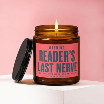 Amber candle with lit wick on pink background, featuring "WARNING: READER'S LAST NERVE" text.