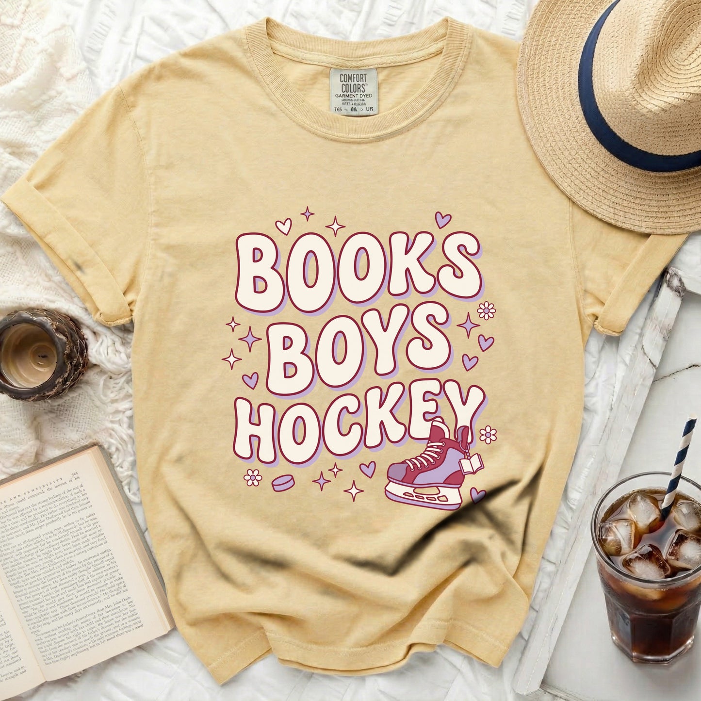 Yellow t-shirt with "Books Boys Hockey" text and roller skate graphic.