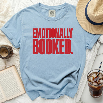 Light blue t-shirt with red text "EMOTIONALLY BOOKED."