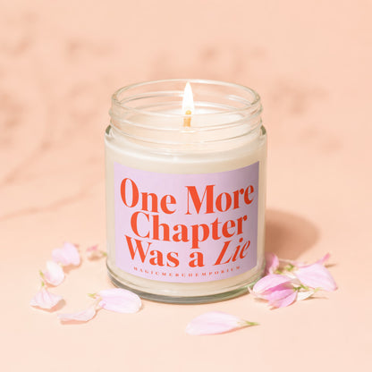 Lit candle in glass jar with label "One More Chapter Was a Lie".