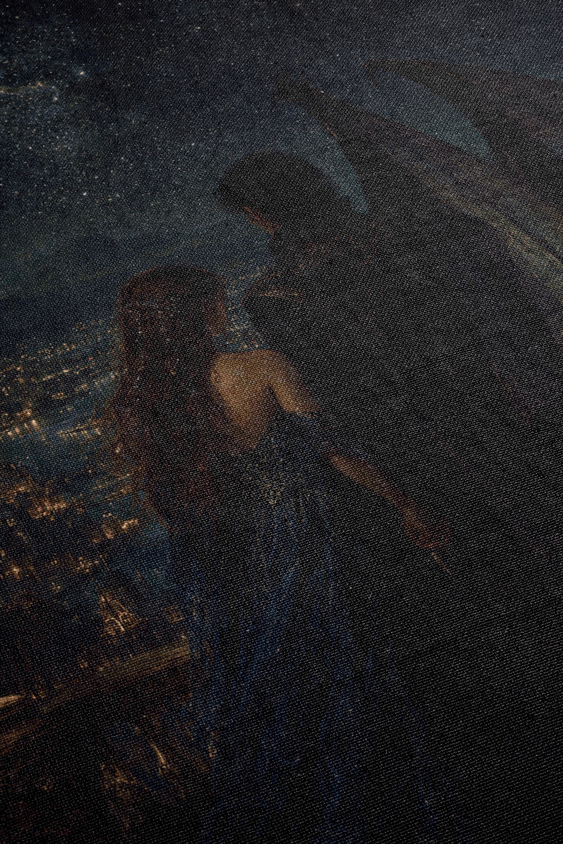 a woman with long, flowing hair standing in a dark, moody setting, with a cityscape visible in the background.