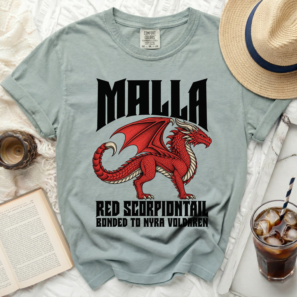 Light green t-shirt with a red dragon graphic, "MALLA," and text.