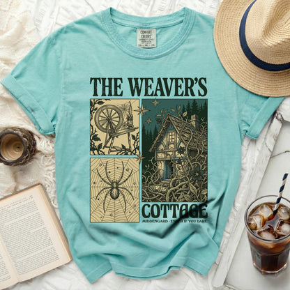 The Weaver's Cottage: spider, spinning wheel, cottage graphic on turquoise shirt.