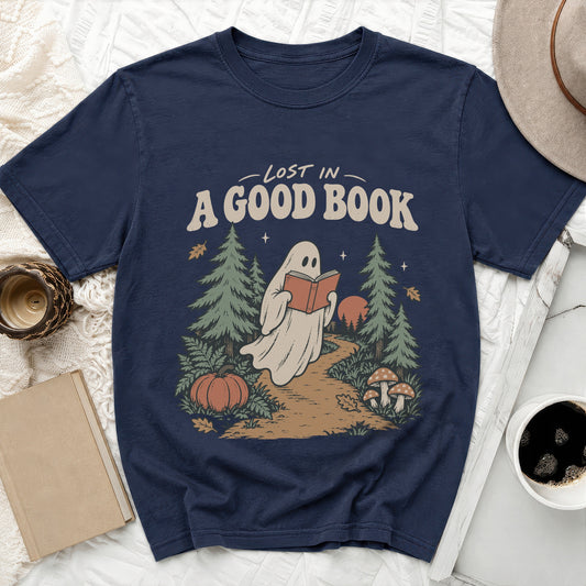 Ghost reading a book in a forest with text "LOST IN A GOOD BOOK".