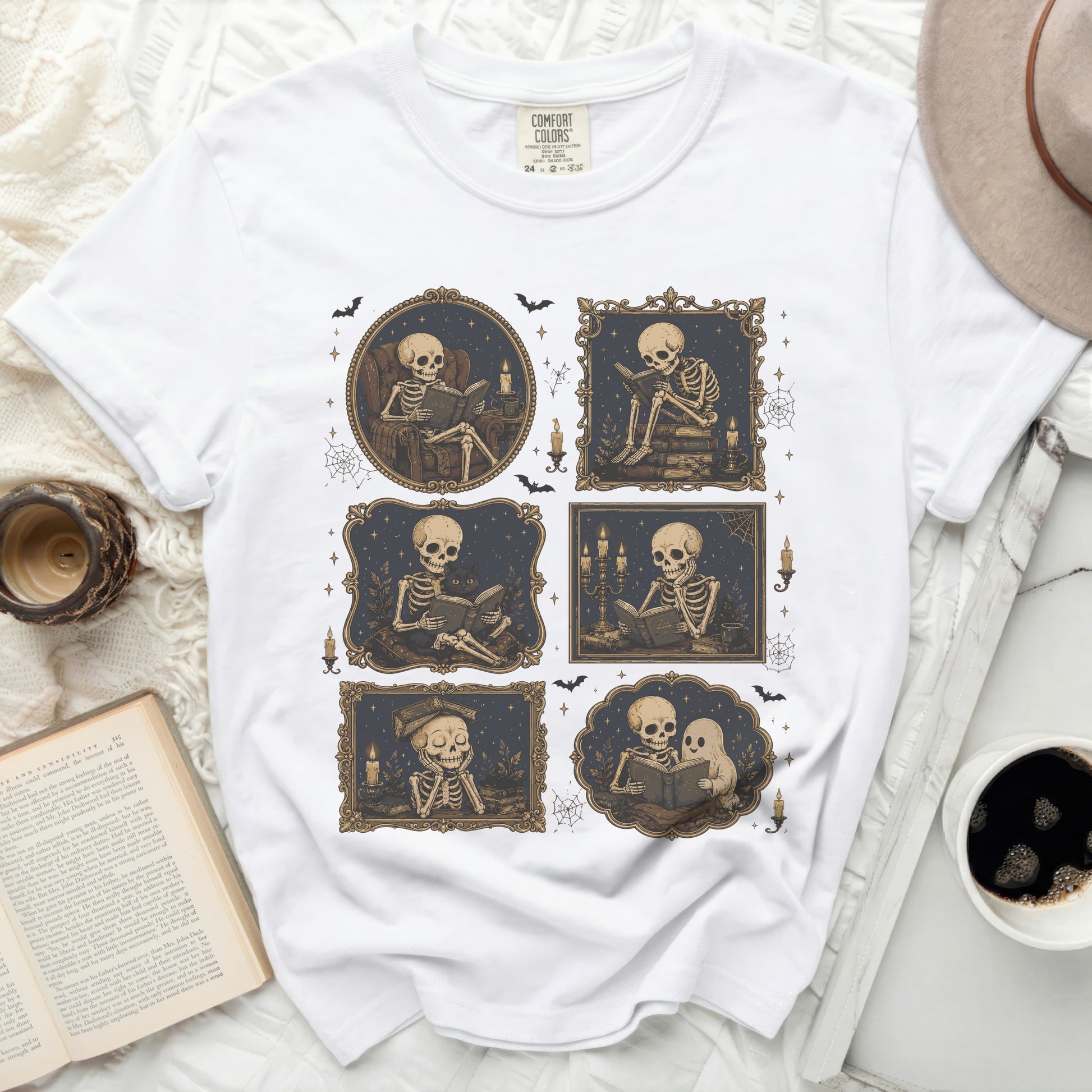 White t-shirt with six framed illustrations of skeletons reading and a hat.