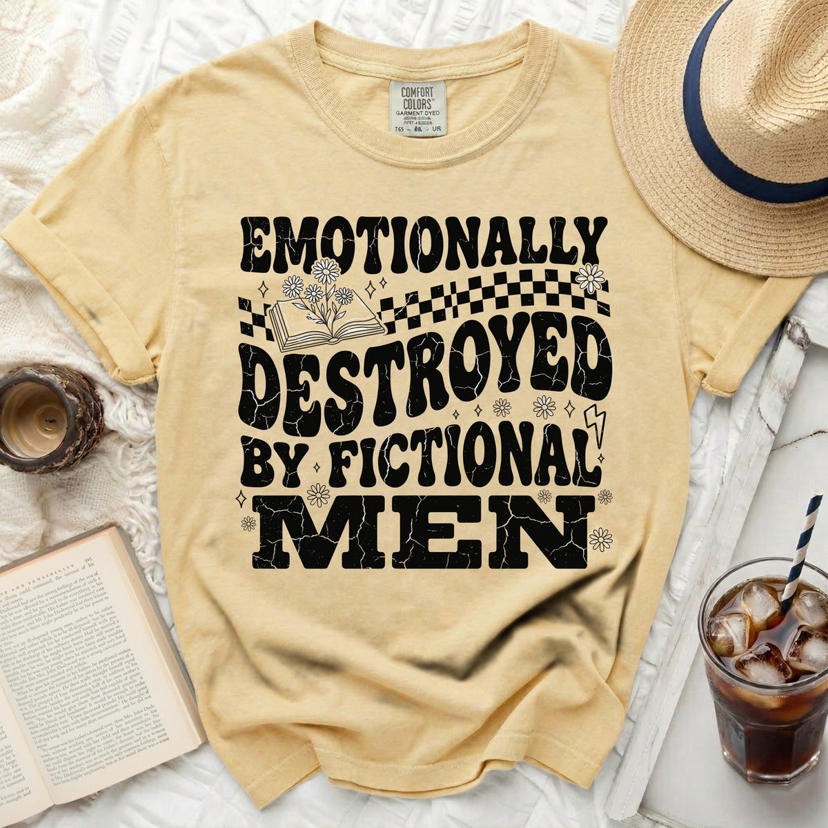 Yellow t-shirt with black text "Emotionally Destroyed By Fictional Men"