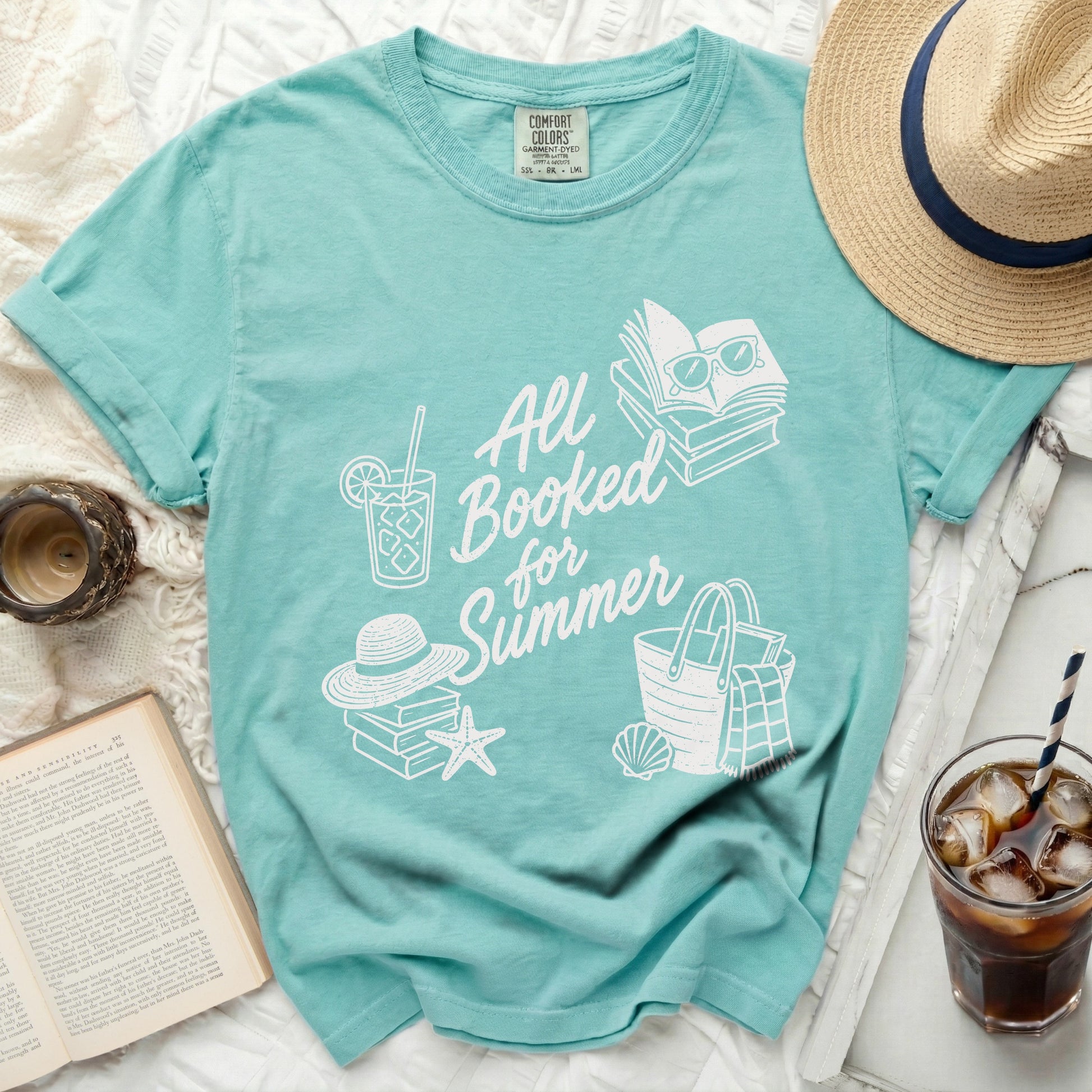 All Booked for Summer graphic t-shirt with beach accessories.
