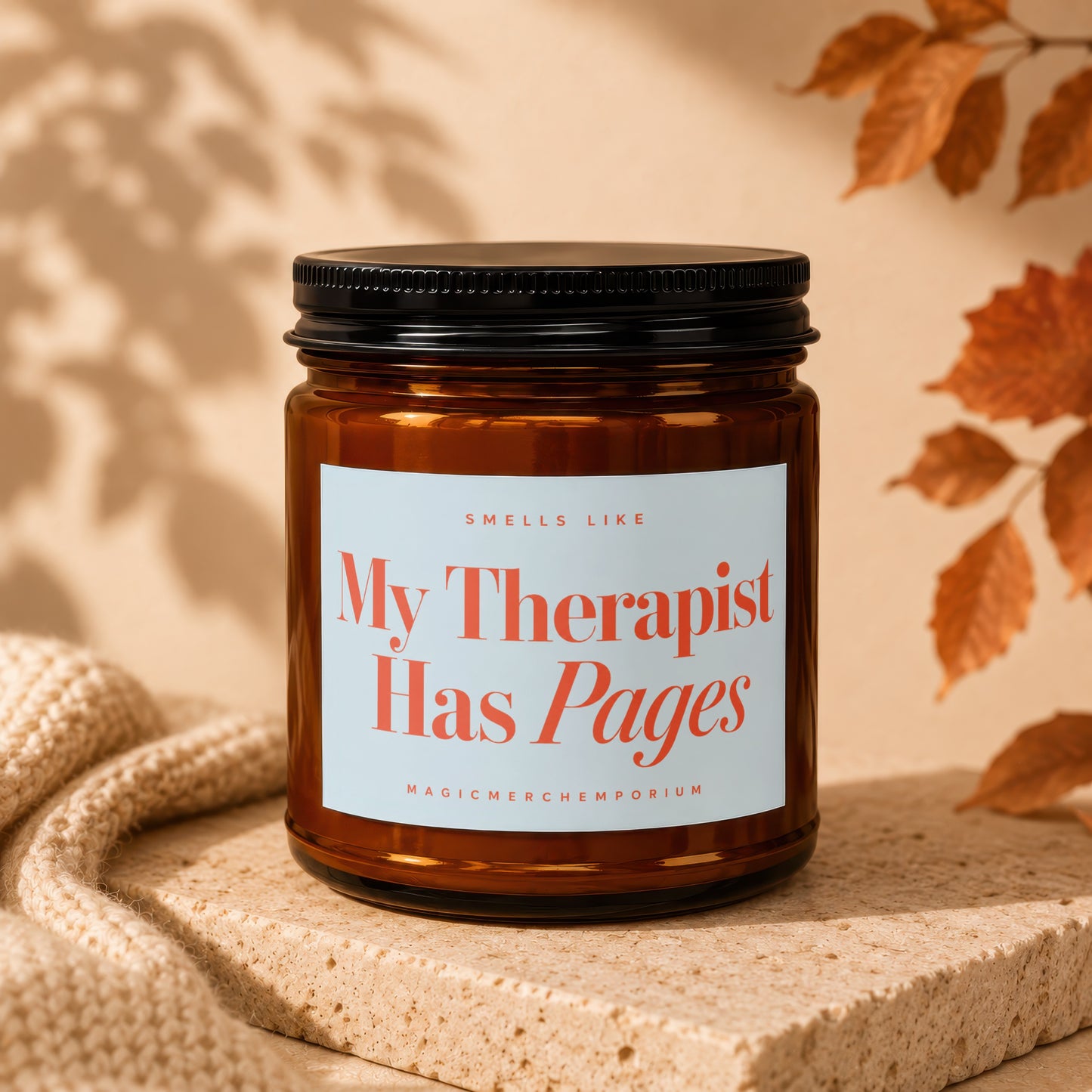 Amber jar candle with "My Therapist Has Pages" printed in coral text.