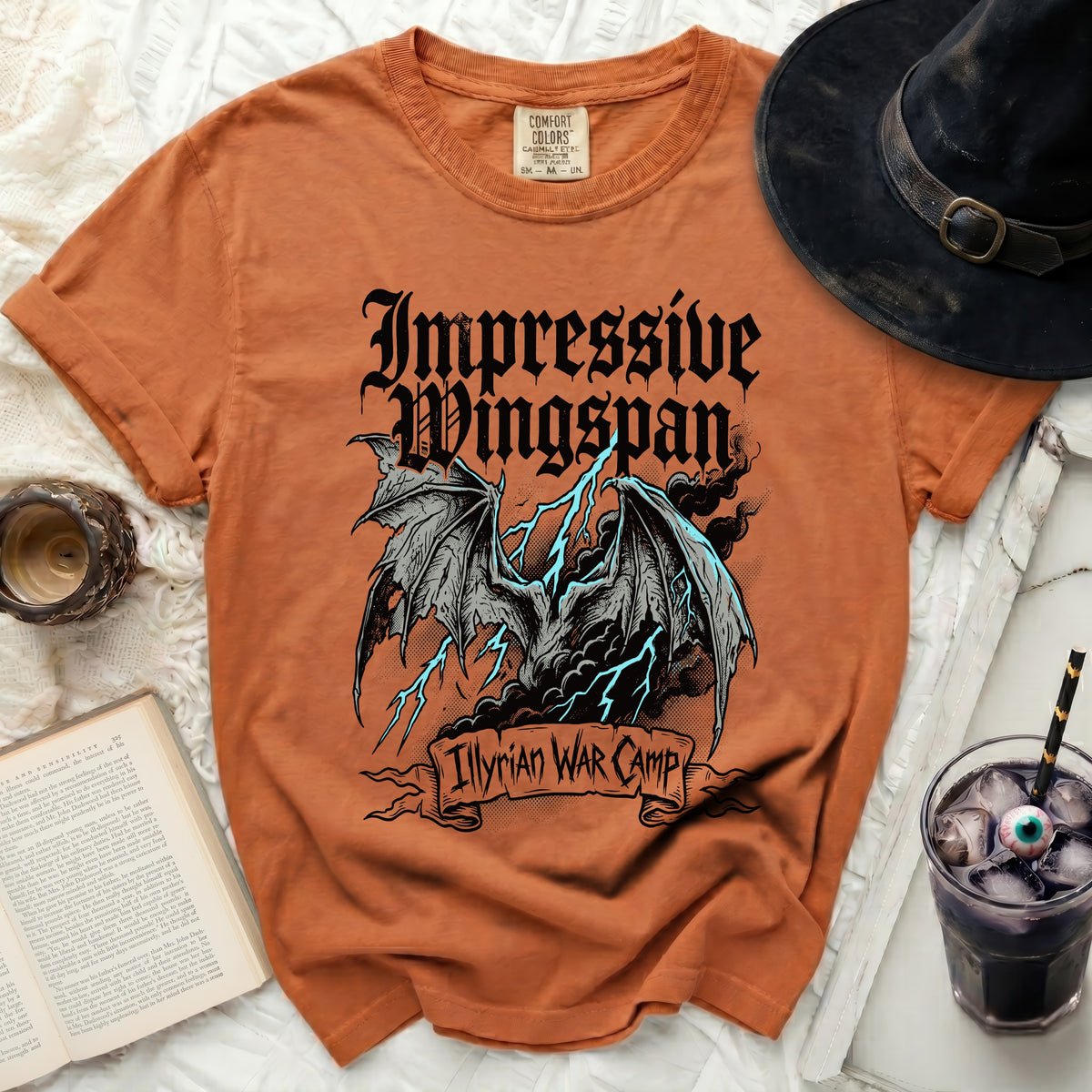 Orange t-shirt with dragon graphic and text "Impressive Wingspan Illyrian War Camp".