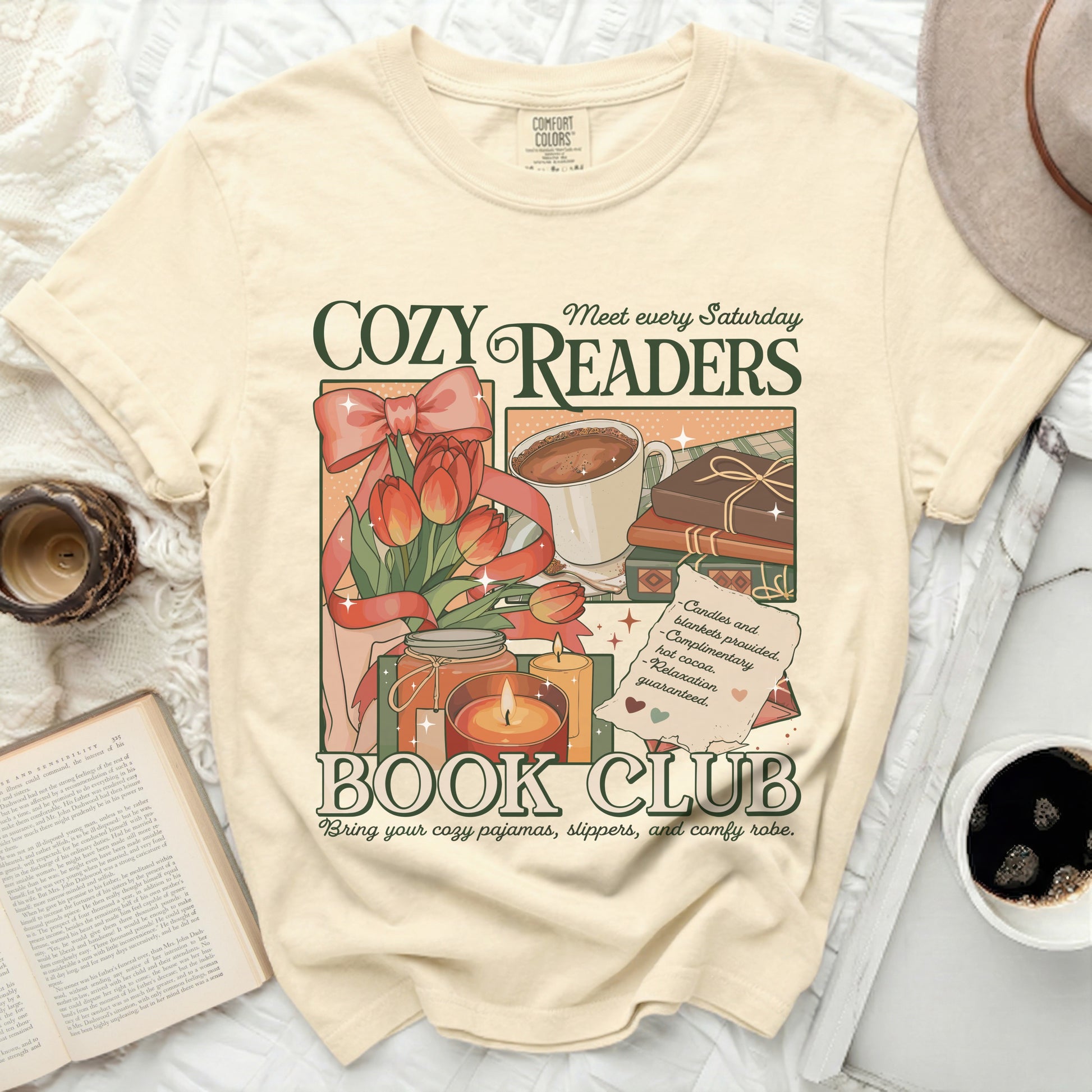 T-shirt with "Cozy Readers Book Club" graphic featuring tulips, hot cocoa, and books.