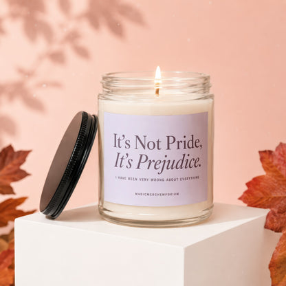 Scented candle with "It's Not Pride, It's Prejudice" quote lit and on a white cube.