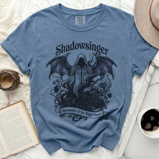 Blue t-shirt with "Shadowsinger" and "Spymaster of the Night Court" text and gothic imagery.