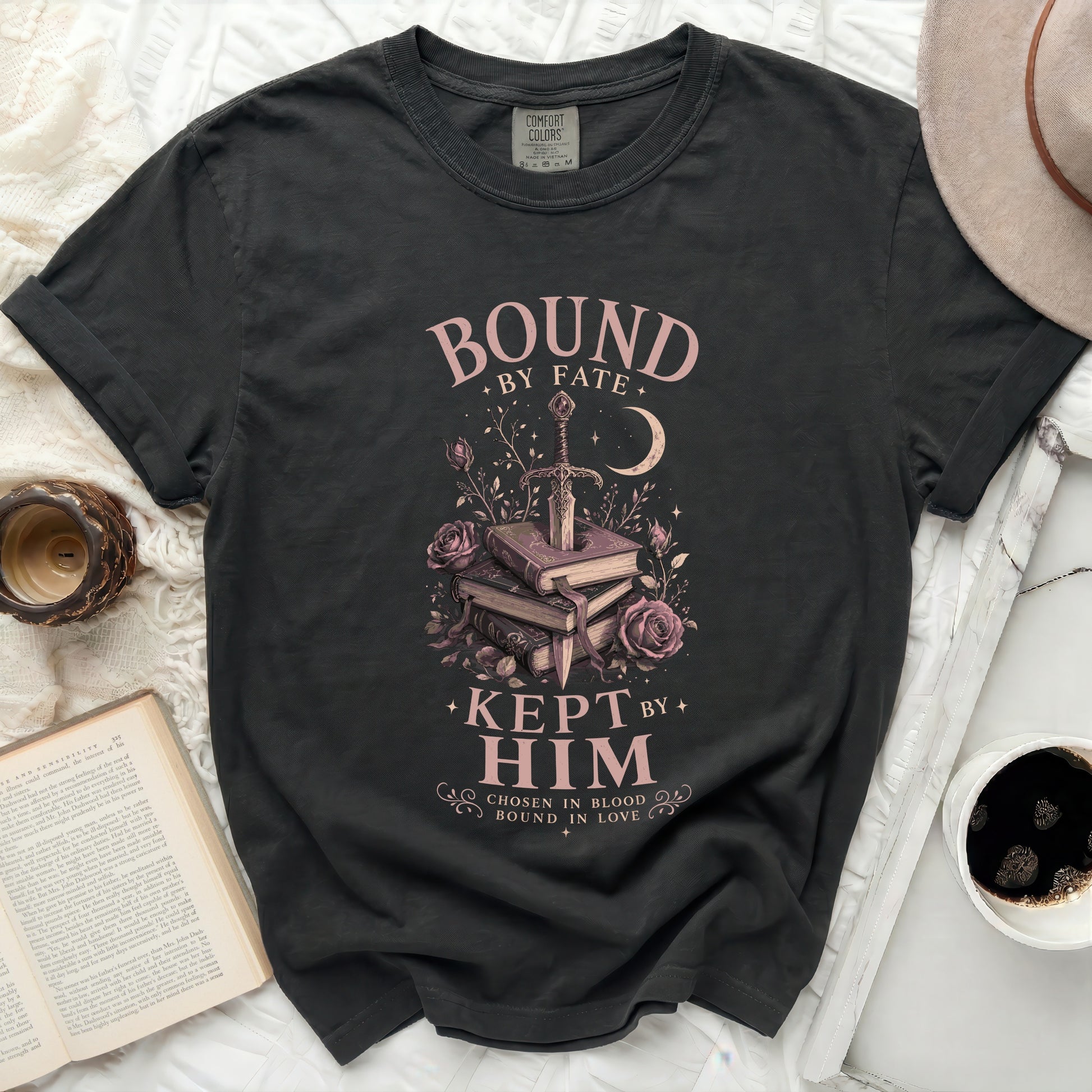 Black Comfort Colors t-shirt with "Bound by Fate, Kept by Him" text and sword graphic.