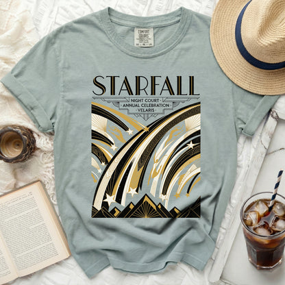 Dusty blue t-shirt with "STARFALL NIGHT COURT ANNUAL CELEBRATION VELARIS" graphic.