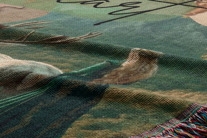 The image is a close-up of a textured fabric with a pattern of green and brown colors.