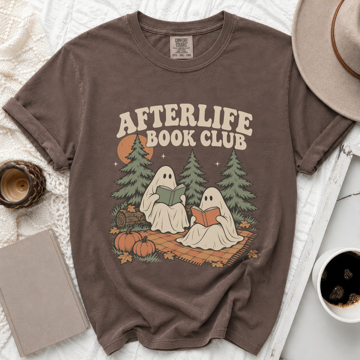 Brown t-shirt with "Afterlife Book Club" text and two ghosts reading books.