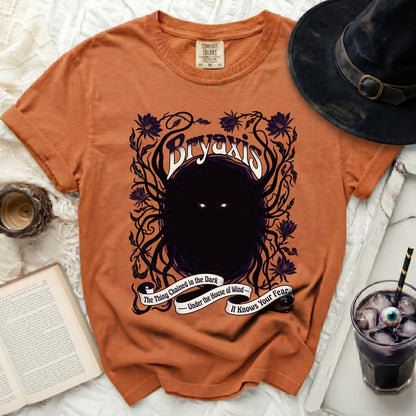 Orange Comfort Colors shirt with "Bryaxis" and horror-themed text.