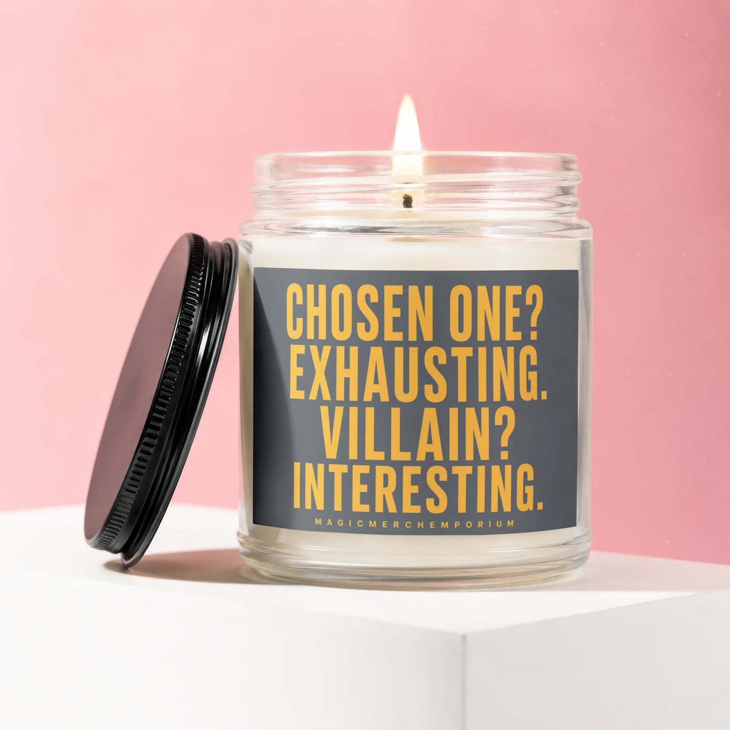 Glass candle with black lid, featuring text "CHOSEN ONE? EXHAUSTING. VILLAIN? INTERESTING."