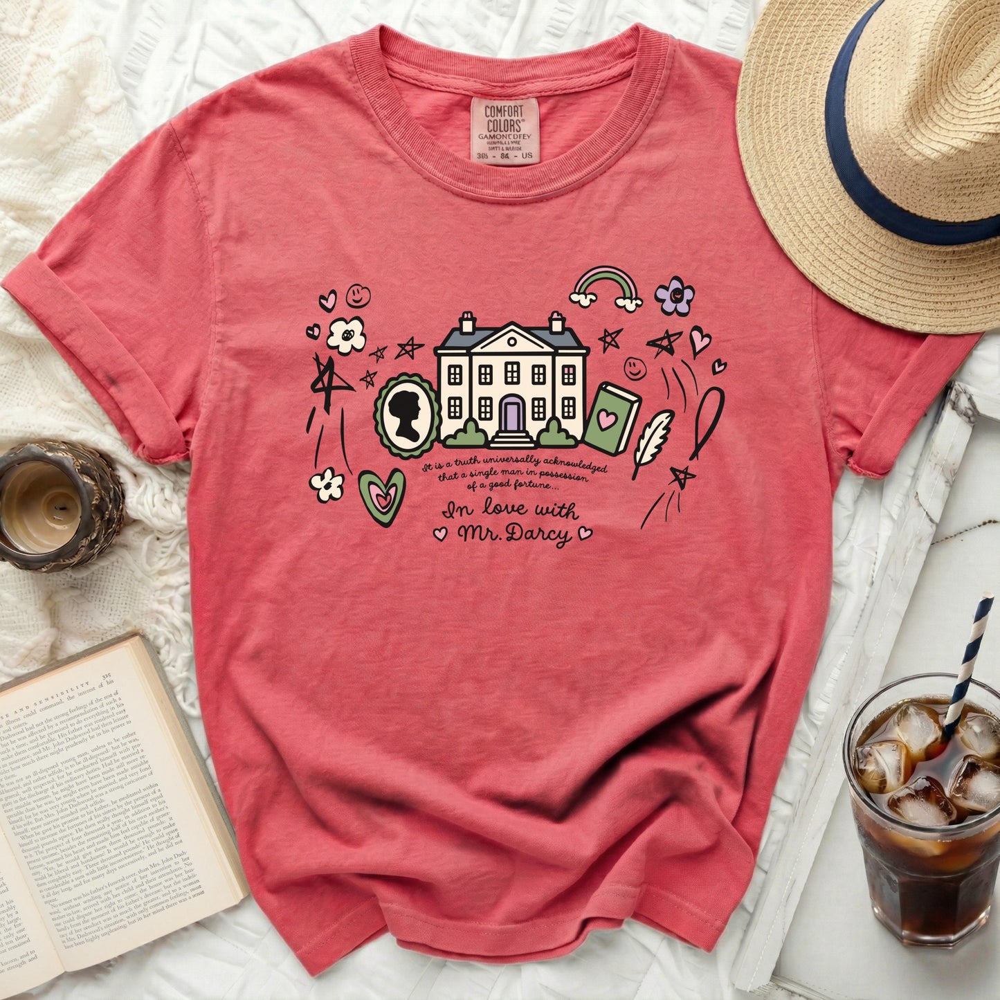Coral t-shirt featuring a house, silhouette, and text "In love with Mr. Darcy".