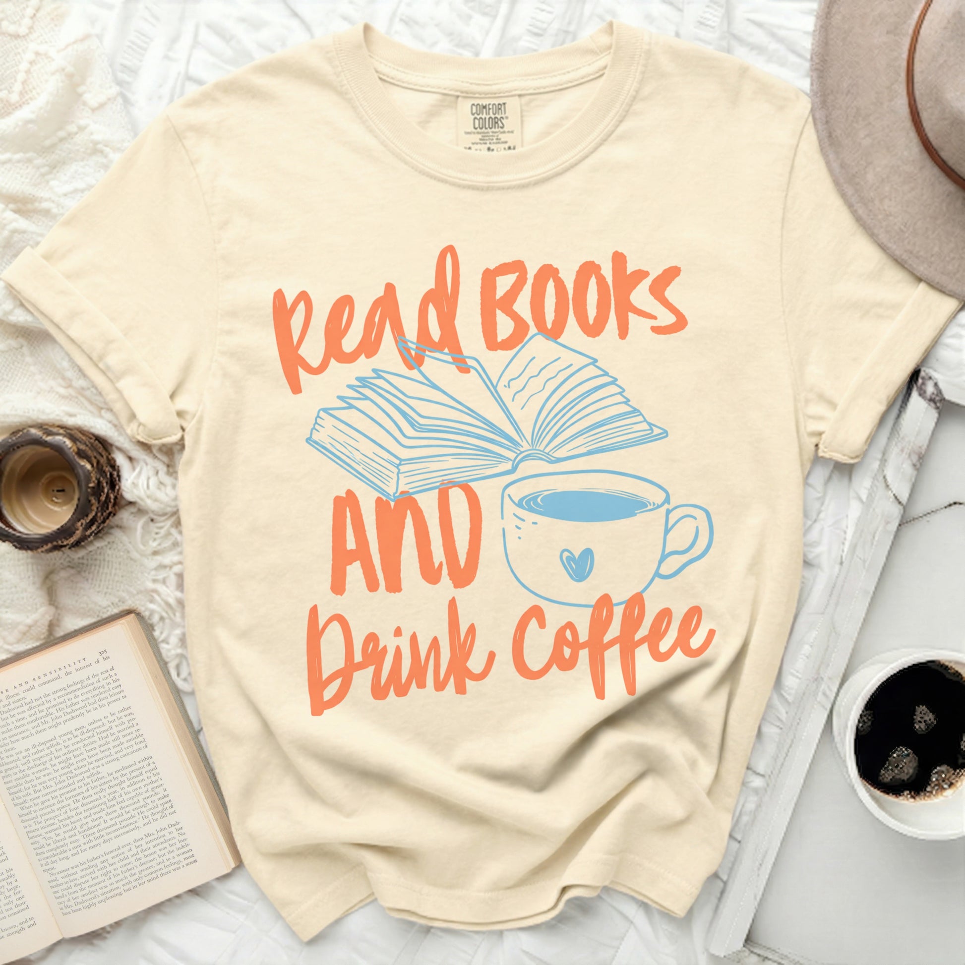 Cream t-shirt with "Read Books AND Drink Coffee" text and graphics.