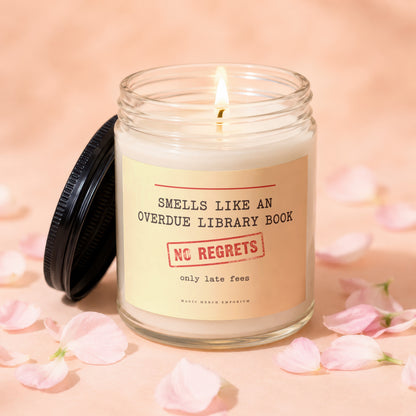 Lit candle in a jar with label: "Smells like an overdue library book. No regrets. Only late fees."