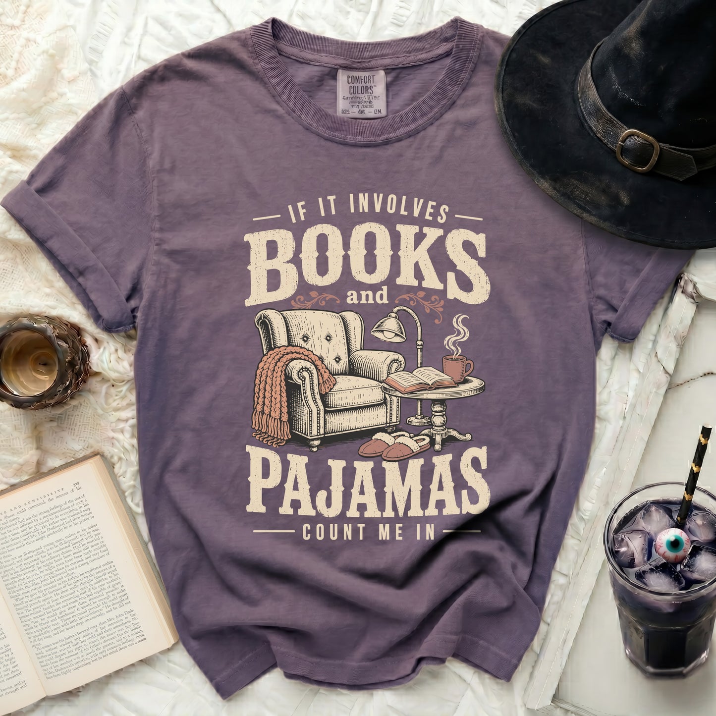 Purple t-shirt with "If it involves books and pajamas count me in" graphic.