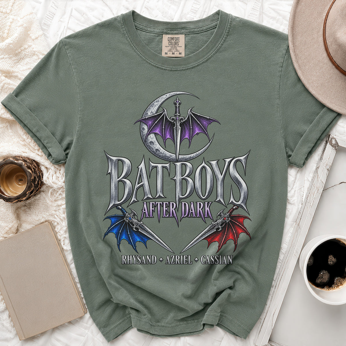 Sage green Comfort Colors t-shirt with "Bat Boys After Dark" text and sword graphics.