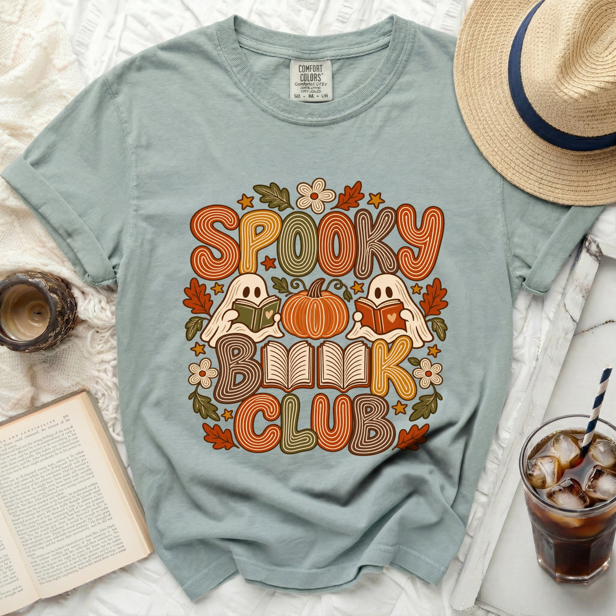 Light blue t-shirt with "Spooky Book Club" graphic featuring ghosts and a pumpkin.
