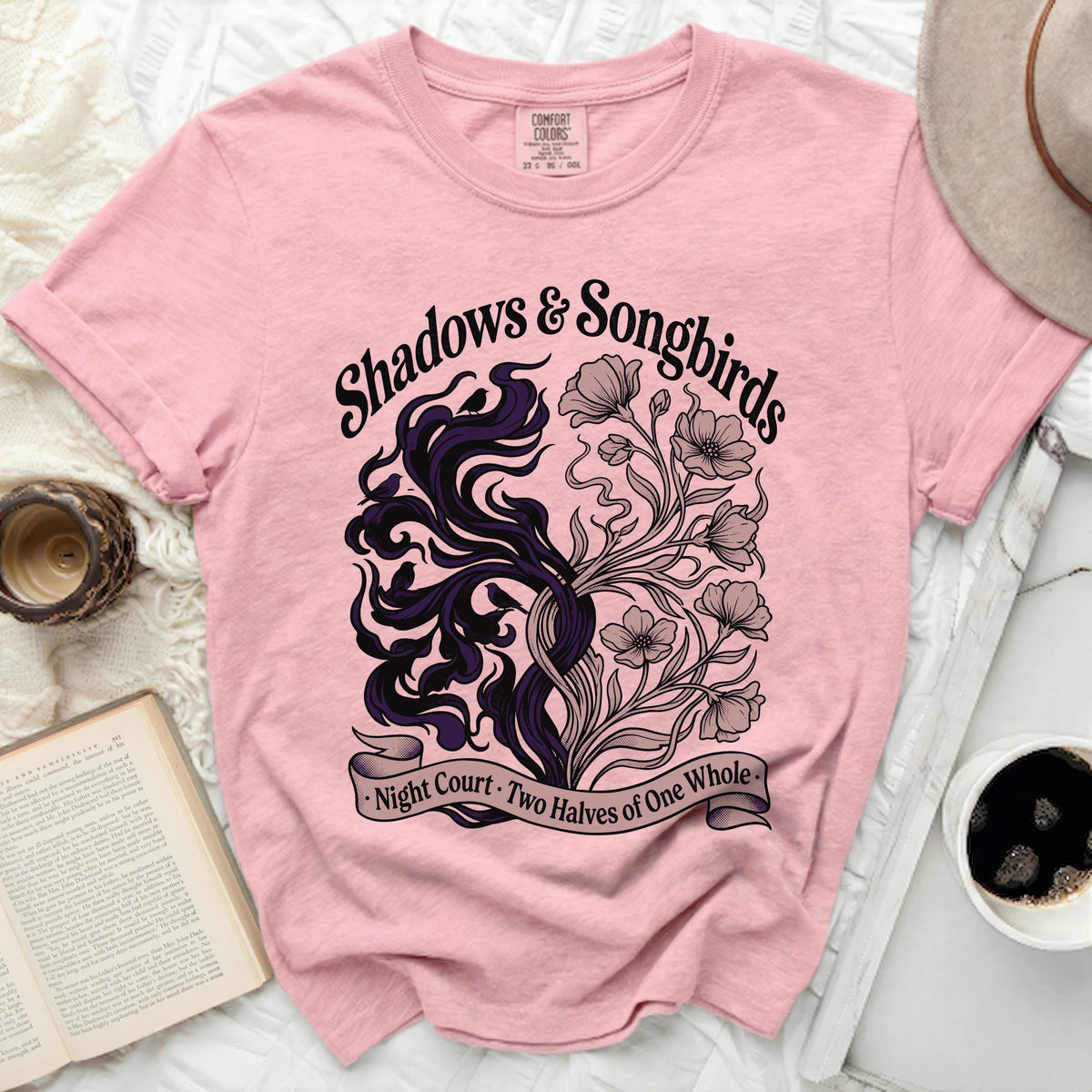 Pink t-shirt with "Shadows & Songbirds, Night Court, Two Halves of One Whole" text.
